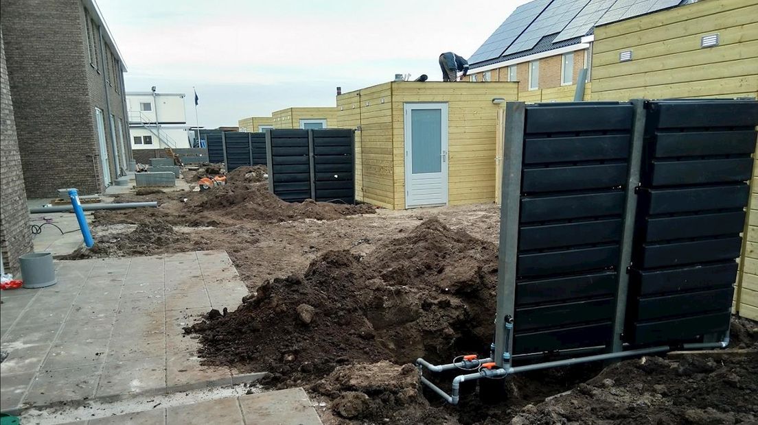 Plaatsen regenwaterschuttingen bij de nieuwbouw