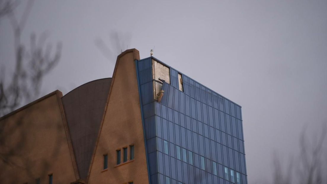 Blown away and loose panels at the top of the Gasunie building