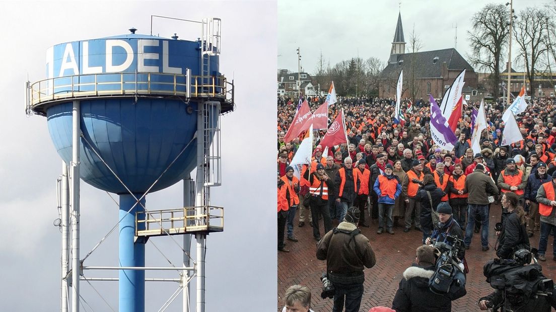 Een protestactie, links de toren van Aldel