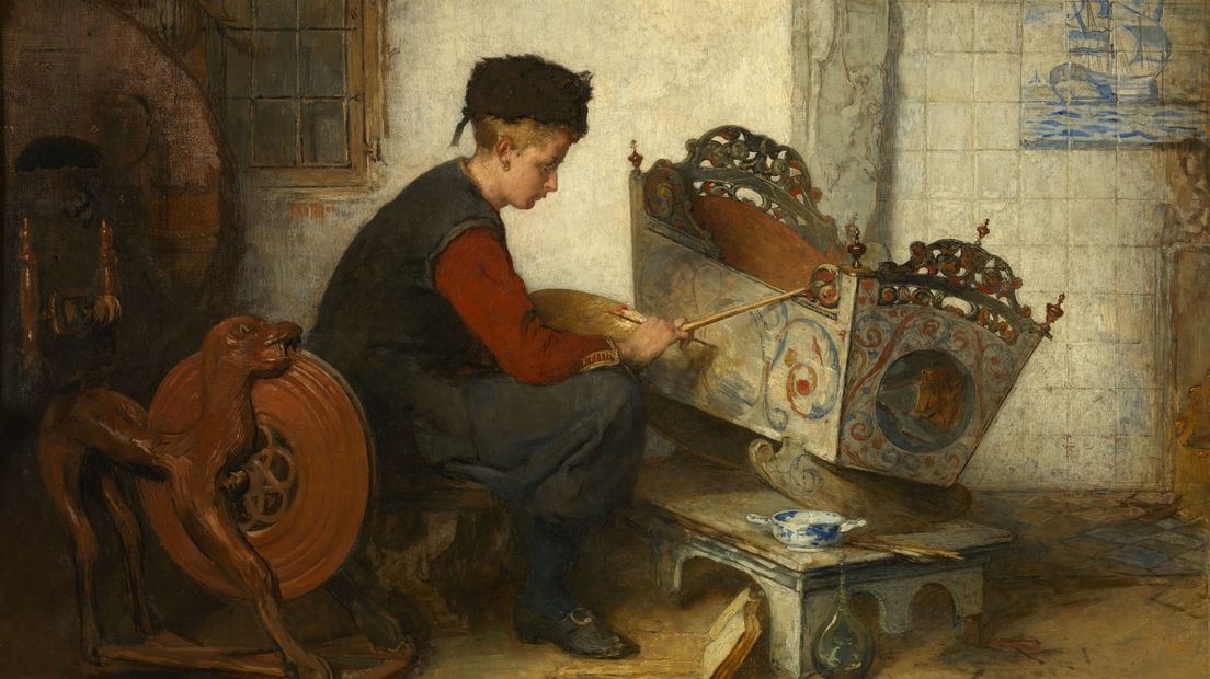 Een ander werk van Bisschop dat Hindeloopen laat zien: 'Jongen die een wieg beschildert', 1899-1901.