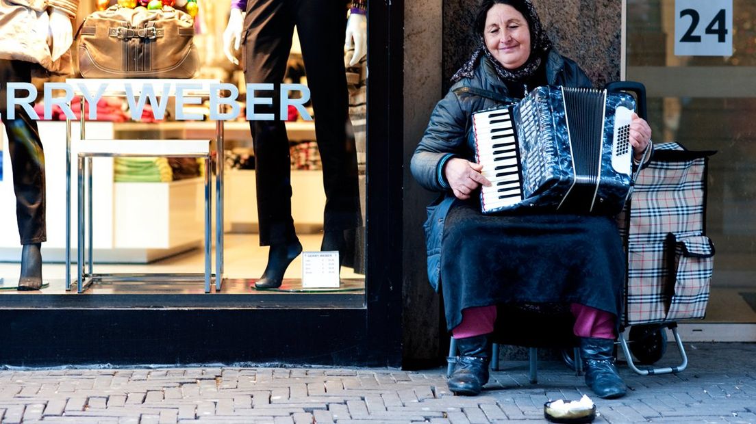 Straatmuzikant in de Haagse Grote Marktstraat. | Foto ANP