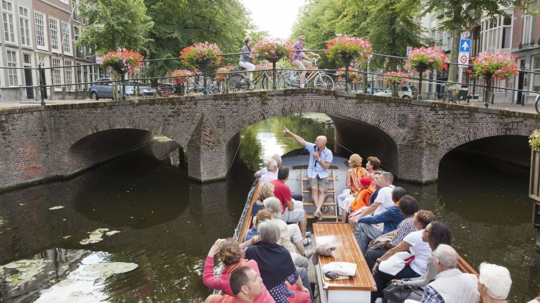 people on a boat trip through the canals of The Hague