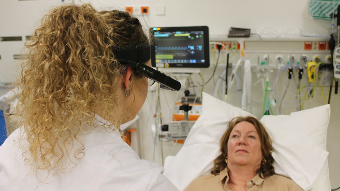 A neurologist can see from a distance through the camera that the doctor is switched on.