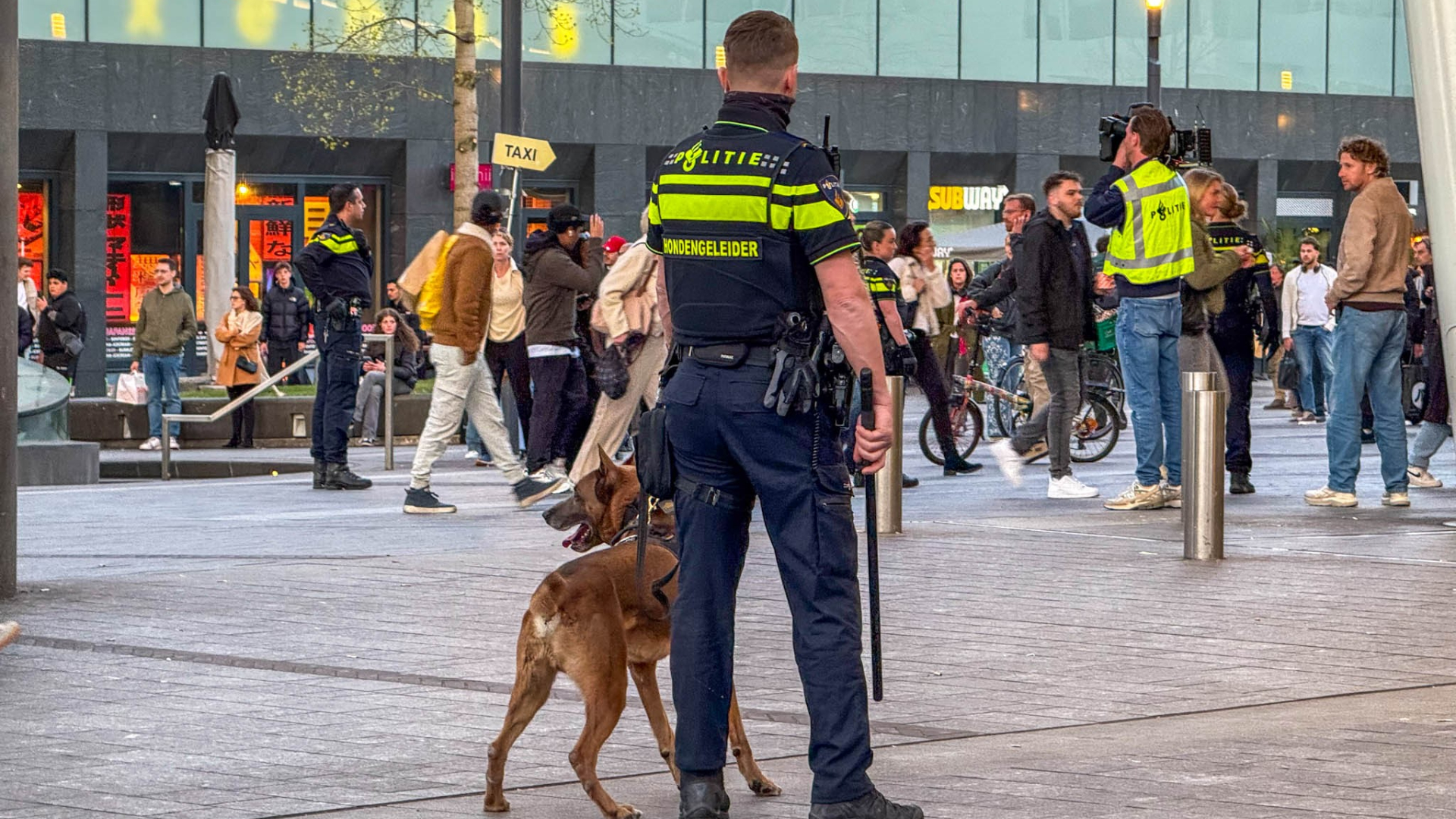 Police officers with dogs ‌at Utrecht Central Station.