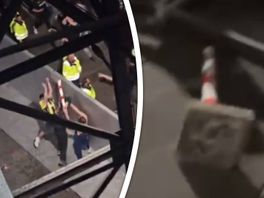 Drie mannen gooiden een paal over het hek op Feyenoord-supporters.