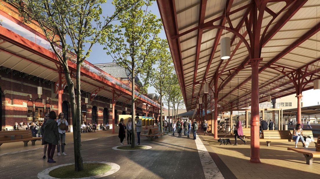 Perronplein en winkels achter het monumentale stationsgebouw