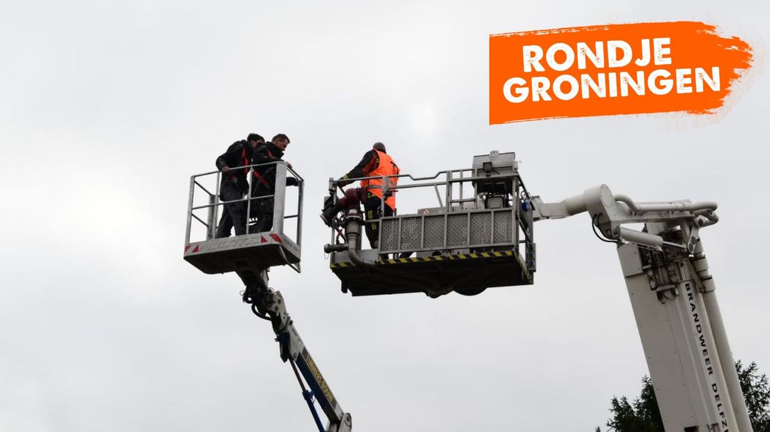 Twee bouwvakkers zitten vast op hoogte