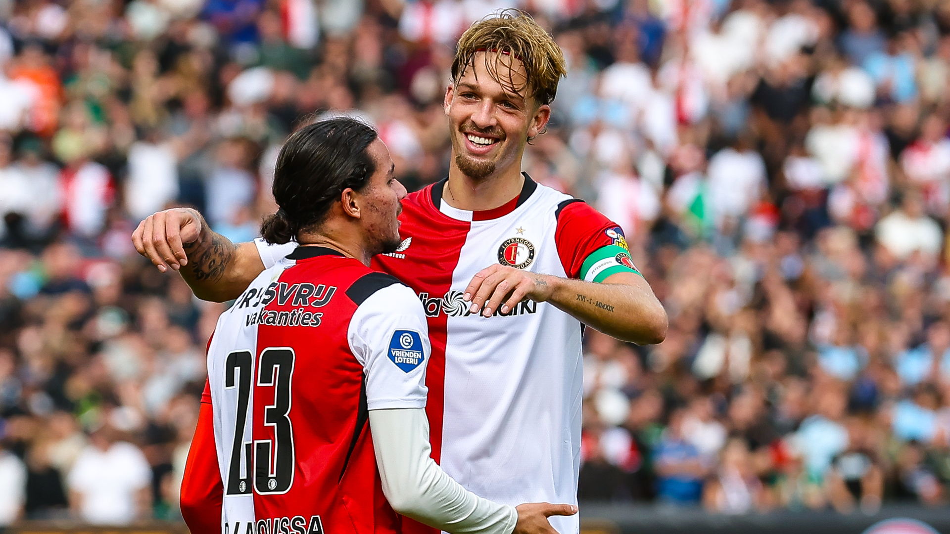 Luciano Valente en Anis Hadj Moussa vieren een doelpunt tegen FC Utrecht