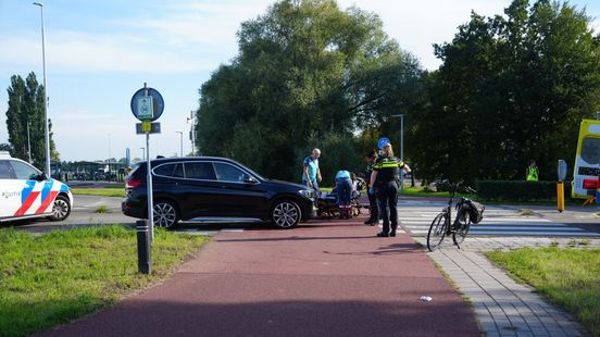 Wielrenner hard onderuit • gewonden bij woningbrand