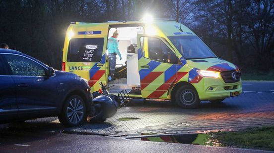 Automobilist schept scooterrijder