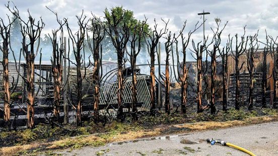 Brand in Tricht • loods in vlammen op