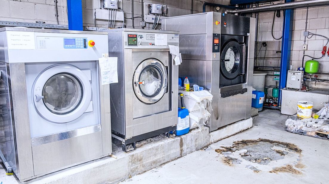 Schade aan de vloer na brand in de wasserij
